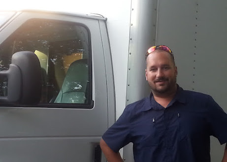 Owner of Arlington Plumber Pros in front of the service van